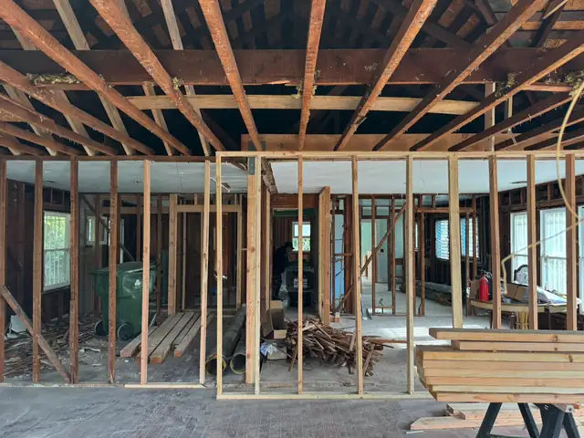 Interior framed out to the studs with the ceiling joists exposed