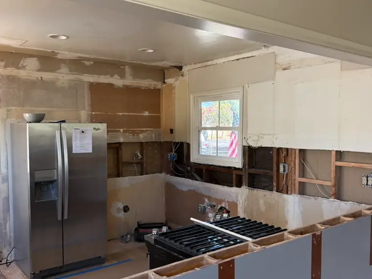 Kitchen after demolition, stripped back to the walls